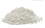 Pile of pale gray powdered agricultural gypsum