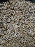 Close-up of brown neem cake pellets