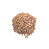 Pile of reddish-brown karanja seed meal