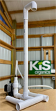 Assembled 50 gallon Microbulator PVC stand with air pump in front of a KiS Organics sign