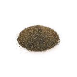 Pile of dark green-brown organic kelp meal on a white background